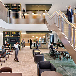 People walking up a staircase.