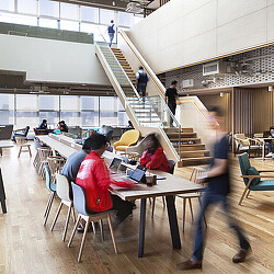 People sitting at tables in a room.